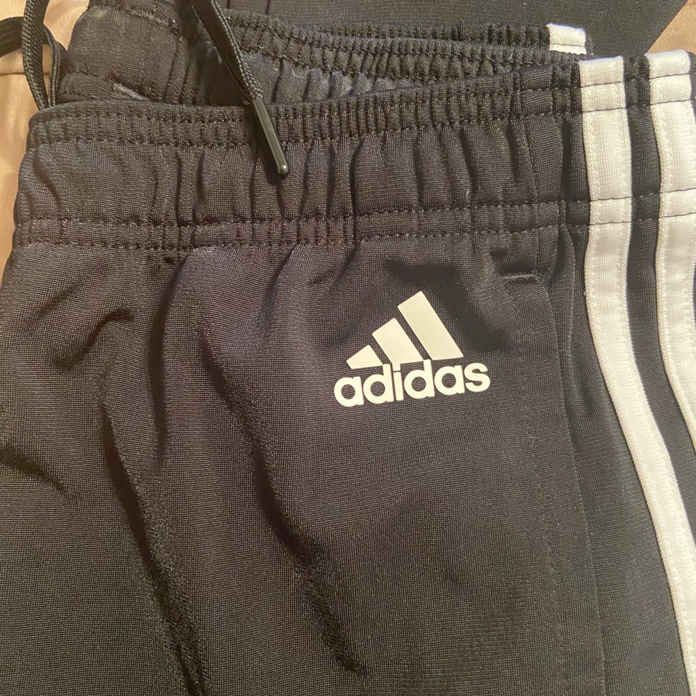Women’s adidas track pants.